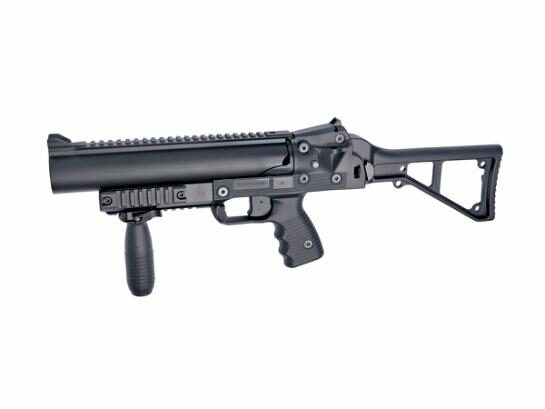 Black ASG B&T GL-06 single-shot grenade launcher with a folding skeleton stock and a vertical foregrip.