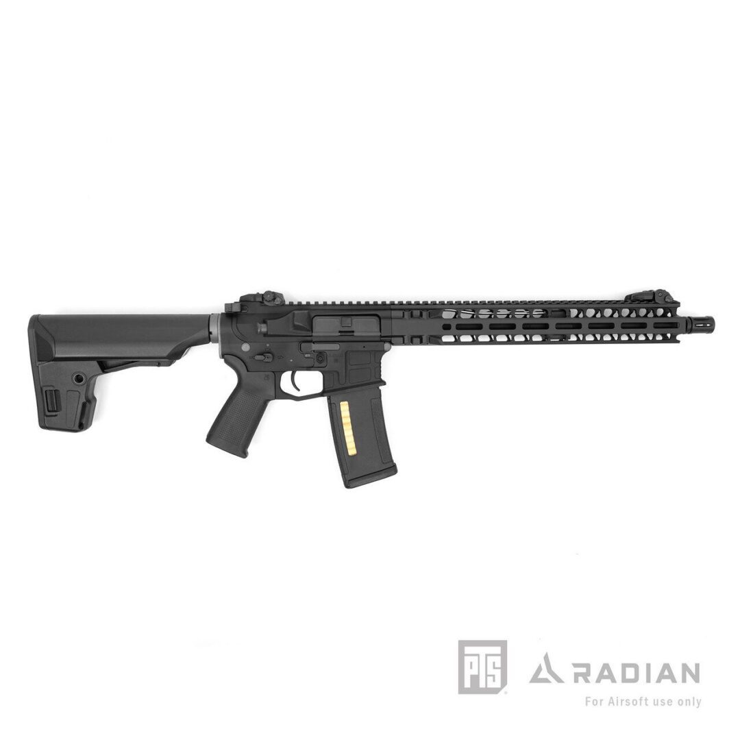 Black PTS Radian Model 1 AEG Recoil Rifle with ETU, featuring a modular handguard, telescopic stock, and a magazine with visible dummy cartridges.