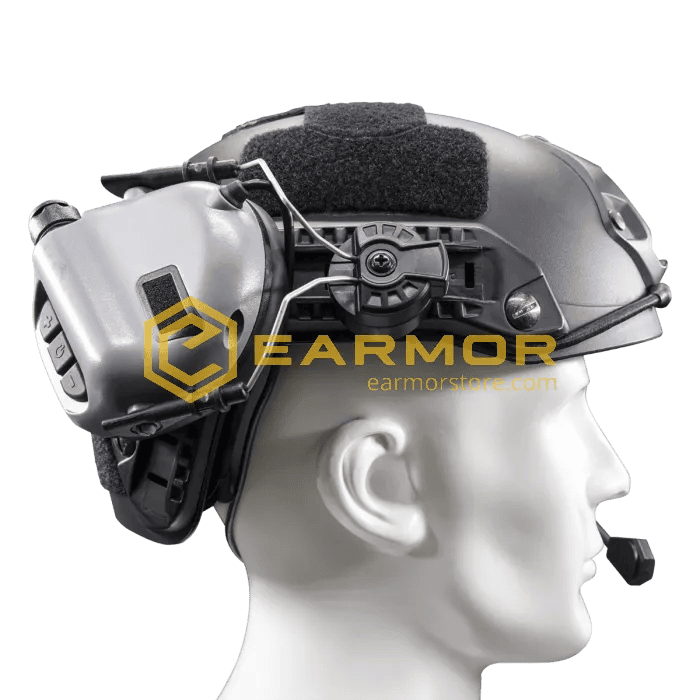 Earmor M11 ARC Helmet Adapter attached to an earmuff communication headset on a tactical helmet worn by a mannequin head.