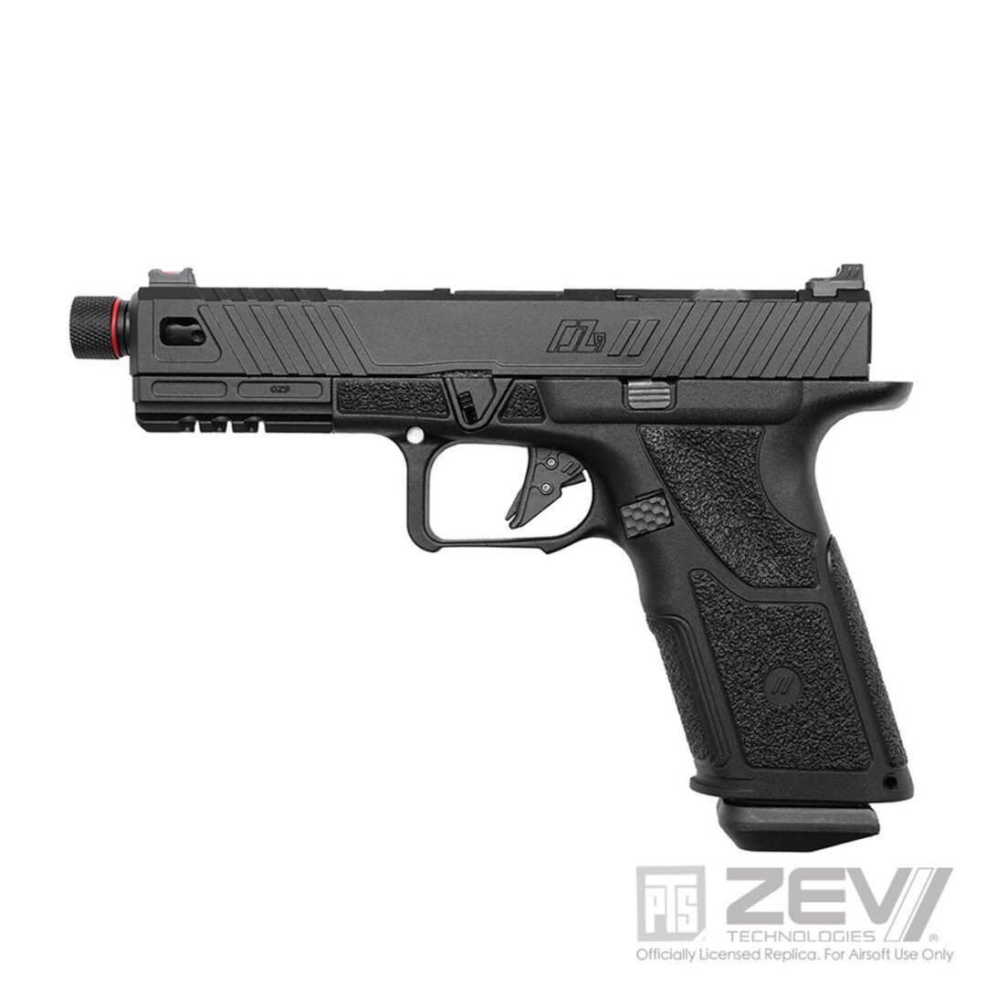 PTS ZEV OZ9 Elite (Standard version) Gas Blowback Pistol Black, a gas blowback airsoft pistol with a threaded red-tipped barrel and a textured grip.