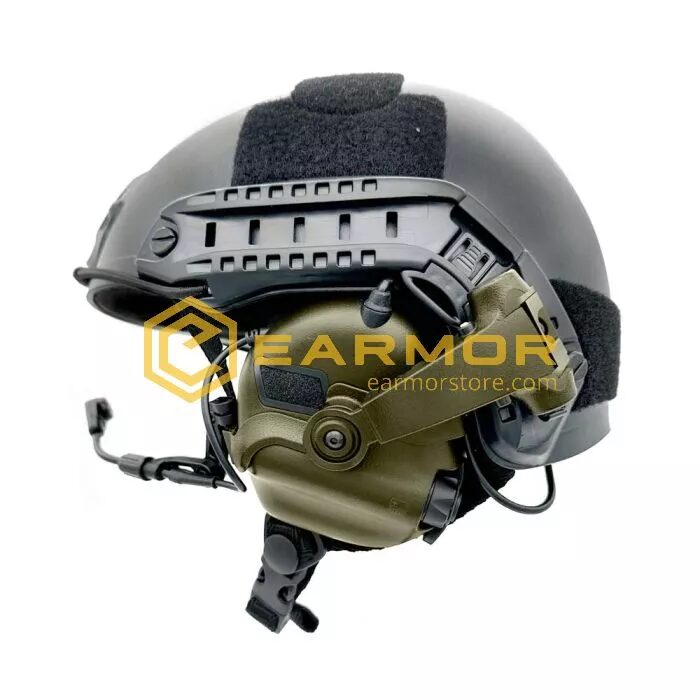 Olive green Earmor M32X Tactical Headset with Microphone attached to a black helmet via ARC helmet adapters.
