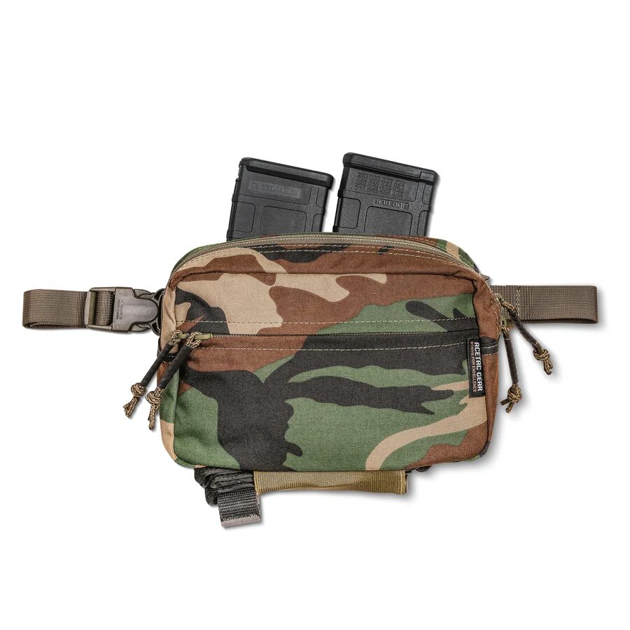 ACETAC Swag V2 Hybrid Fanny Pack in camouflage with two rifle magazines inserted in the top compartment.