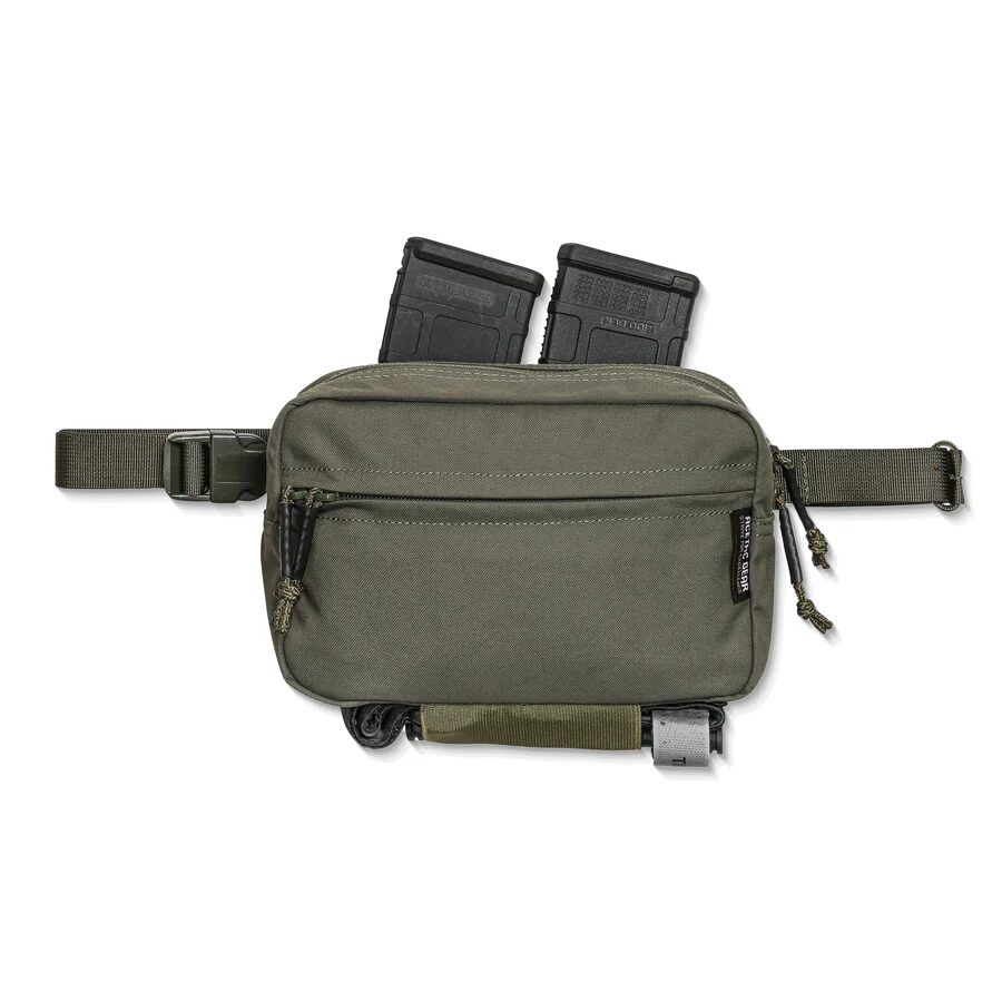 Olive green ACETAC Swag V2 Hybrid Fanny Pack with two magazines inserted in the top and a tourniquet secured to the bottom webbing.