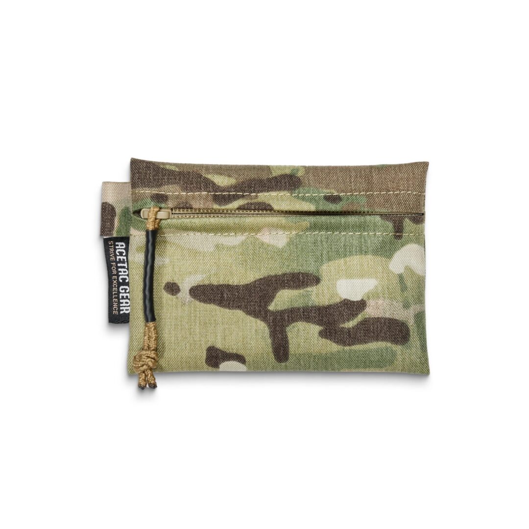 Acetac Ketchall Pouch, a small rectangular zippered pouch in a camouflage pattern with a branded tag on the side.